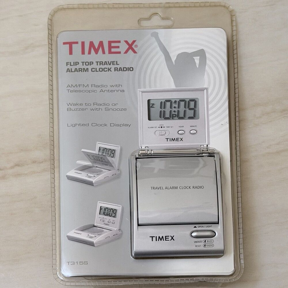 The TIMEX Flip Top Travel Alarm Clock AM/FM Portable Radio Model T315S Sealed